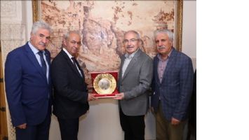 Vali Yaman, Güvel´e ziyaretin anısına plaket verdi